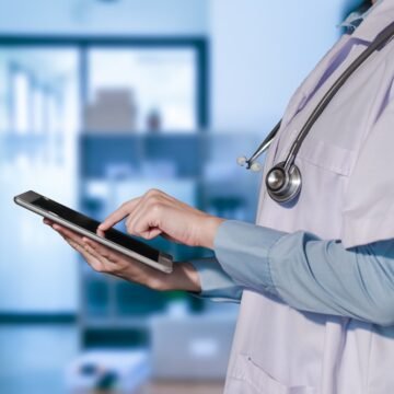 Healthcare,And,Medicine.,Doctor,Using,A,Digital,Tablet. Digital Marketing for Hospitals: Strategies to Grow Patient Engagement and Trust
