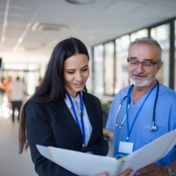 Doctor,And,Business,Woman,In,Hospital,Reading,Documents. Streamlining Hospital Operations: Key Strategies for Efficiency and Growth